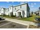 Exterior angle of a well-maintained two-story townhouse with neat landscaping and sidewalk at 1171 Sand Torch Cir, Davenport, FL 33837