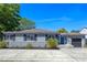 Charming single-story home featuring manicured landscaping, a driveway, and a cozy front porch at 1316 N Bumby Ave, Orlando, FL 32803