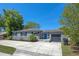 Charming single-story home with a well-manicured lawn, gray paint, a driveway, and a one car garage at 1316 N Bumby Ave, Orlando, FL 32803