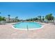 A stunning pool surrounded by lounge chairs and palm trees, perfect for relaxation and enjoying the sunny weather at 1999 Grand Oak Dr, Kissimmee, FL 34744