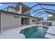 Backyard features a screened-in pool with access to the house with an upper level balcony at 2784 Corbel Loop, Kissimmee, FL 34746
