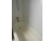 A white tiled bathtub with a shower head at 4745 S Texas Ave # A, Orlando, FL 32839