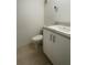 Bathroom featuring tile floors, a toilet, and vanity with white cabinet at 4745 S Texas Ave # A, Orlando, FL 32839