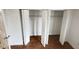 Bedroom closet with folding doors and wire shelving for organization and storage at 4745 S Texas Ave # A, Orlando, FL 32839