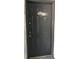 View of a gray front door with a knocker, peephole, and unit number at 4745 S Texas Ave # A, Orlando, FL 32839