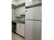 Bright kitchen with white cabinets, laminate counters, stainless steel dishwasher, and white refrigerator at 4745 S Texas Ave # A, Orlando, FL 32839