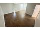 Bright living room with wood-look floors and sliding glass doors to a patio at 4745 S Texas Ave # A, Orlando, FL 32839