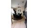 Dining area featuring a dark table, seating for six, and a ceiling fan at 639 Gull Dr, Poinciana, FL 34759