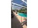 Screened in pool with palm trees and an outdoor seating area at 639 Gull Dr, Poinciana, FL 34759