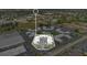 Aerial view of condo community highlighting central buildings, parking, and proximity to shops and businesses at 1038 Plantation Dr # D9, Kissimmee, FL 34741
