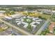 An aerial view of a condo community featuring tidy landscaping, plentiful parking, and a central pool at 1038 Plantation Dr # D9, Kissimmee, FL 34741