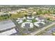 Aerial view of the apartment complex showcasing landscaping, parking and pool at 1038 Plantation Dr # D9, Kissimmee, FL 34741