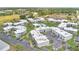Aerial view of the apartment complex showcasing landscaping, parking and pool at 1038 Plantation Dr # D9, Kissimmee, FL 34741