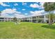 Well-maintained building exteriors with lush landscaping and manicured lawns at 1038 Plantation Dr # D9, Kissimmee, FL 34741