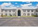 Exterior of condominium complex with blue shutters and a well-maintained parking lot at 1038 Plantation Dr # D9, Kissimmee, FL 34741