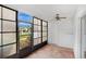Enclosed Florida room with brick floors and views of the outdoor landscape at 1038 Plantation Dr # D9, Kissimmee, FL 34741