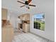 Well-lit kitchen with natural wood cabinets and modern appliances and views through a window at 1038 Plantation Dr # D9, Kissimmee, FL 34741