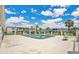 Community pool area with ample seating, landscaping, and lounge chairs at 1038 Plantation Dr # D9, Kissimmee, FL 34741