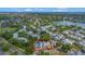 Aerial view of a multi-Gathering residential complex surrounded by lush greenery and adjacent to a scenic lake at 1051 S Hiawassee Rd # 2127, Orlando, FL 32835
