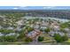 An aerial shot focuses on the building, its location, and the beautiful landscape surrounding the property at 1051 S Hiawassee Rd # 2127, Orlando, FL 32835
