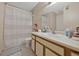 Traditional bathroom with a shower, neutral-toned vanity, and modern sink at 1051 S Hiawassee Rd # 2127, Orlando, FL 32835