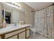 A standard bathroom has a tub with shower and a white countertop vanity with a round sink at 1051 S Hiawassee Rd # 2127, Orlando, FL 32835