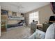 The room features a bunkbed, grey walls, and neutral carpet at 1051 S Hiawassee Rd # 2127, Orlando, FL 32835