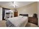 This bedroom is furnished with a queen bed, crib, and dresser at 1051 S Hiawassee Rd # 2127, Orlando, FL 32835