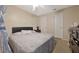 This bedroom is furnished with a queen bed and a nightstand at 1051 S Hiawassee Rd # 2127, Orlando, FL 32835