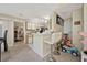 The cozy kitchen features neutral cabinets, white counters, and leads to another bedroom at 1051 S Hiawassee Rd # 2127, Orlando, FL 32835