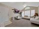 Bright living room featuring a modern sofa, arch window, and decorative wall accents at 1051 S Hiawassee Rd # 2127, Orlando, FL 32835
