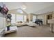 Bright living room featuring a modern sofa, arch window, and ceiling fan at 1051 S Hiawassee Rd # 2127, Orlando, FL 32835