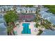 Aerial view of community pool, tennis courts, and residential buildings in a well-maintained complex at 1051 S Hiawassee Rd # 2127, Orlando, FL 32835