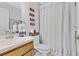 Clean bathroom with a vanity sink, decorative accents, and shower at 1083 Snively Cir, Lake Hamilton, FL 33851