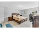 Spacious bedroom featuring neutral decor, a large window, and a comfortable bed at 1083 Snively Cir, Lake Hamilton, FL 33851
