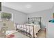 Cozy bedroom featuring simple decor, a comfortable bed, and a bright window at 1083 Snively Cir, Lake Hamilton, FL 33851