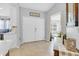 Inviting foyer featuring double front doors, tile flooring, and open view to the living area at 1083 Snively Cir, Lake Hamilton, FL 33851