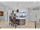 Bright kitchen with a breakfast bar, pendant lighting, and modern appliances at 1083 Snively Cir, Lake Hamilton, FL 33851