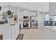 Bright kitchen featuring white cabinets, stainless steel appliances, and an island with seating at 1083 Snively Cir, Lake Hamilton, FL 33851