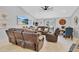 Cozy living room with a ceiling fan, comfortable furniture, and sliding glass doors at 1083 Snively Cir, Lake Hamilton, FL 33851