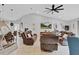 Bright living room with a modern design, comfortable seating, and a stylish ceiling fan at 1083 Snively Cir, Lake Hamilton, FL 33851