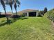 Well-maintained lawn with mature landscaping creates a private outdoor space at 12273 Pescara Ln, Orlando, FL 32827