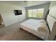 Carpeted bedroom with large window offers plenty of natural light and space at 12273 Pescara Ln, Orlando, FL 32827