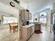 Open kitchen with stainless steel appliances and eat-in breakfast area at 1301 Rebecca Dr, Haines City, FL 33844
