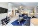 Open concept living room with a seamless flow to the kitchen and dining areas at 1301 Rebecca Dr, Haines City, FL 33844