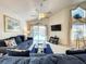 Comfortable living room with ceiling fan and sliding glass door leading to the pool at 1301 Rebecca Dr, Haines City, FL 33844