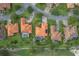 Aerial view of the property, showing lush surroundings and a well-maintained lawn, nearby golf course at 133 Torino Ln, Kissimmee, FL 34759