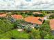 Aerial view of the property showcasing a private backyard with pool and lush landscaping at 133 Torino Ln, Kissimmee, FL 34759