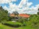 Lush landscaping surrounds this property with views of the pool and back yard at 133 Torino Ln, Kissimmee, FL 34759