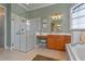 Bathroom with glass shower, vanity, stool and soaking tub creating a spa-like experience at 133 Torino Ln, Kissimmee, FL 34759